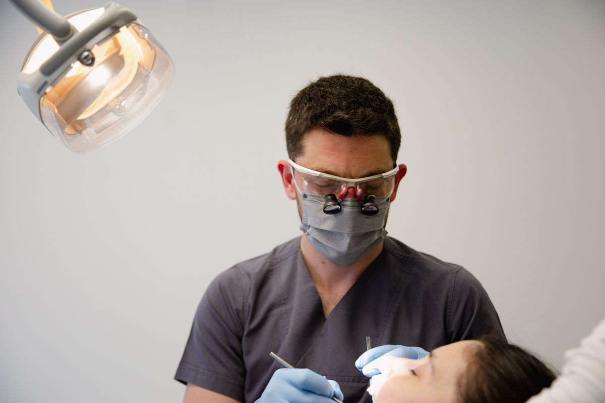 Orthodontist consulting with a patient
